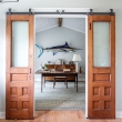 Beach-style-home-office-with-sliding-barn-doors