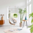 01-Airy-living-room-is-full-of-light-and-greenery-that-binds-it-with-outdoors