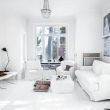 all-white-living-room-with-ethnic-style-cushions